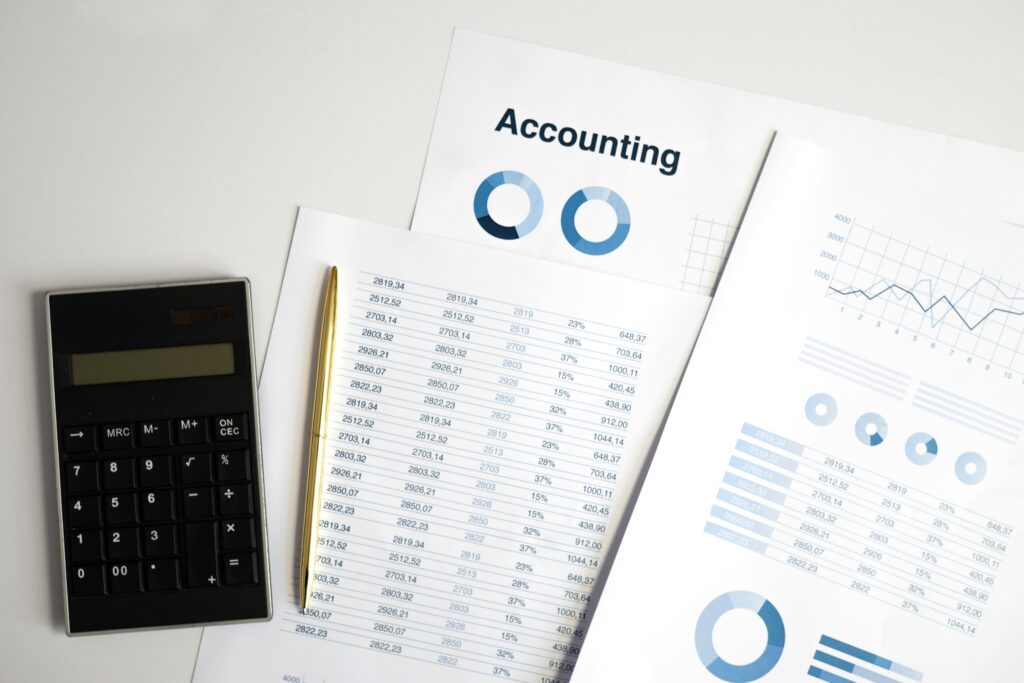 Therapist filling in an S-corp accountable plan template at a home office desk.