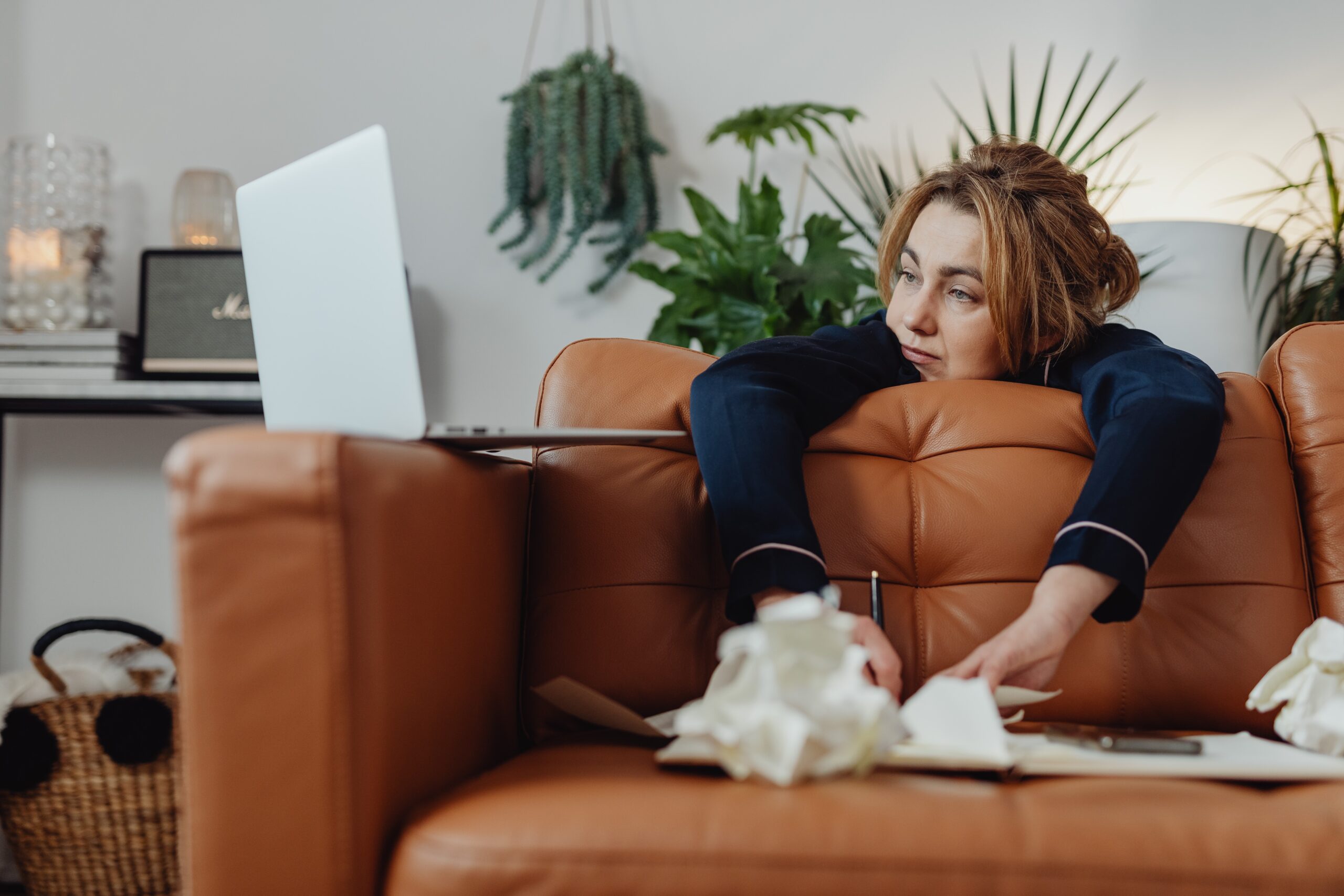 Therapist hiding behind couch attempting to use tax software